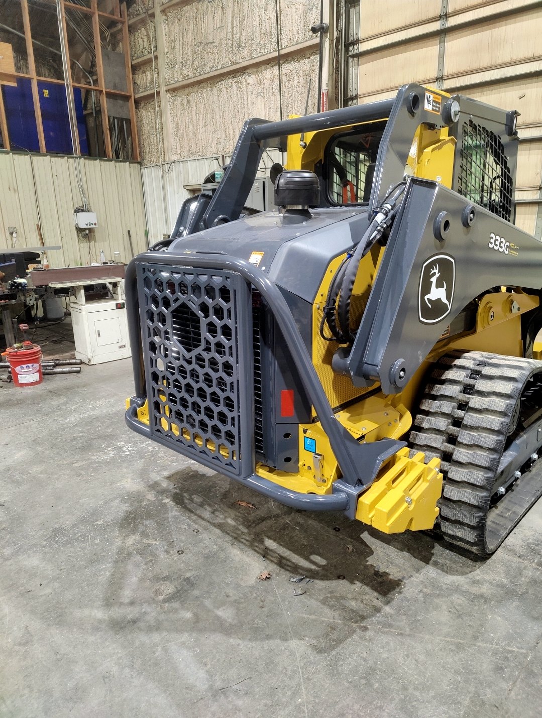 Front view of a fabricated equipment attachment in a shop