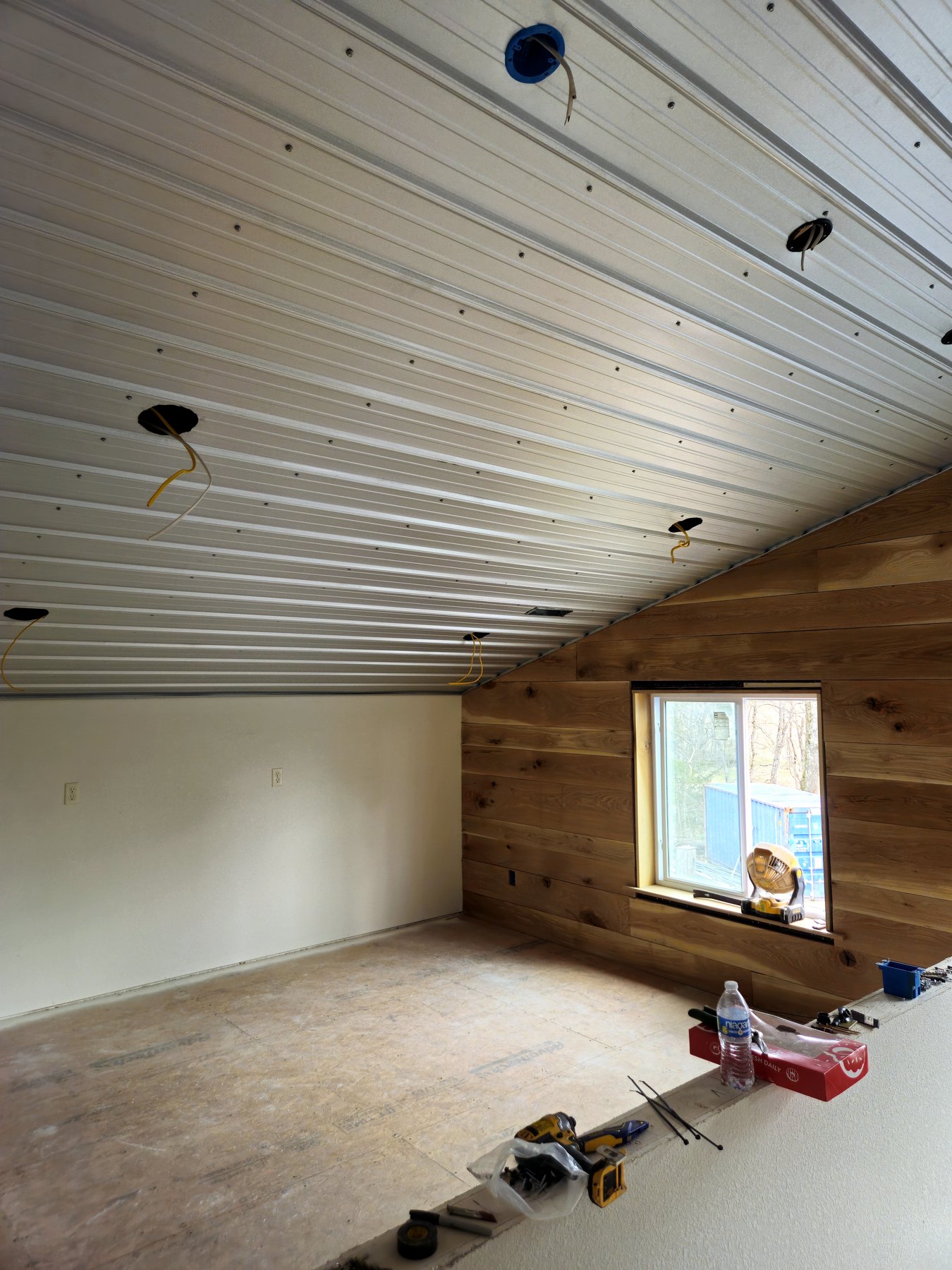Finished ceiling panel installation inside an interior room