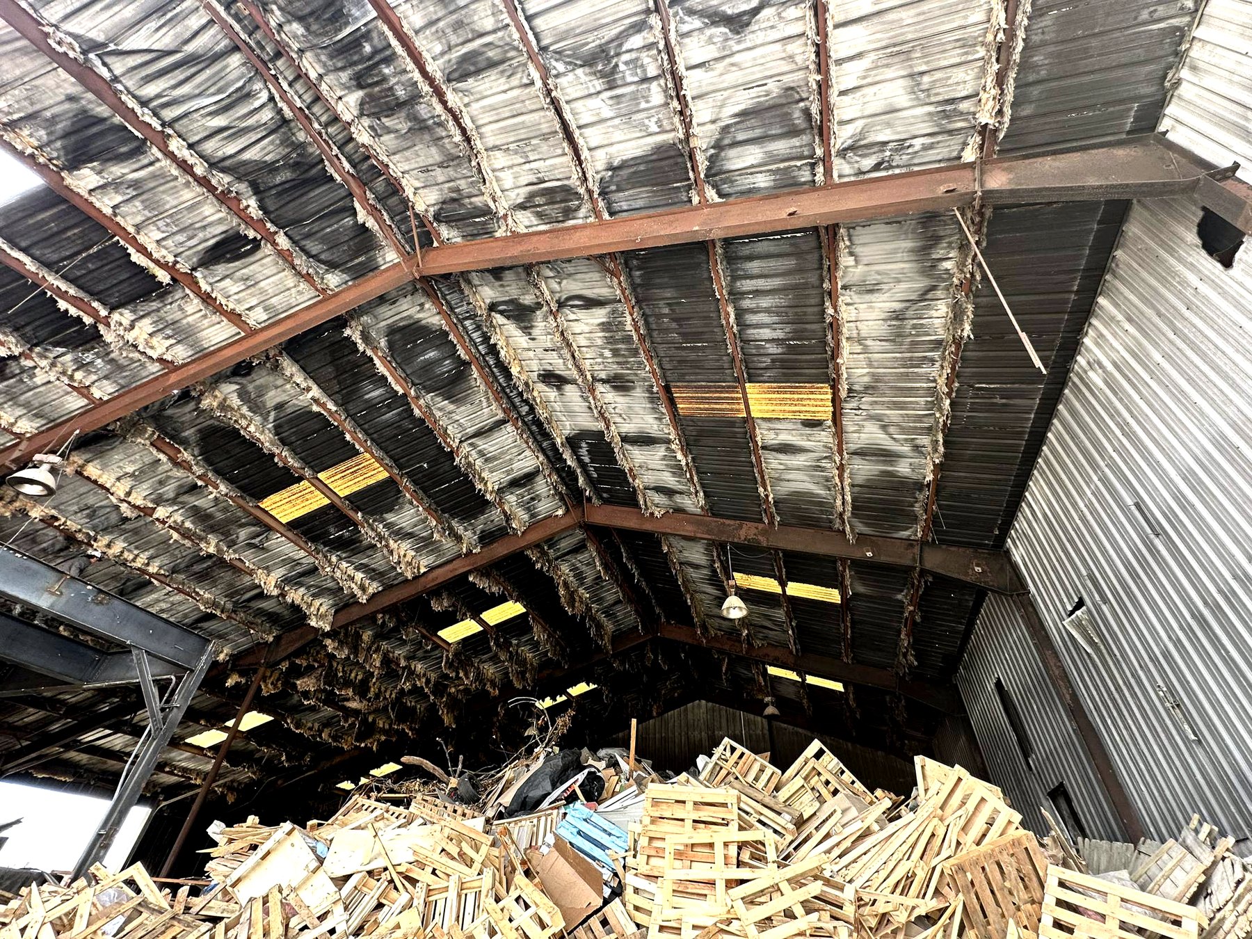 Interior roof structure and debris during demolition cleanup