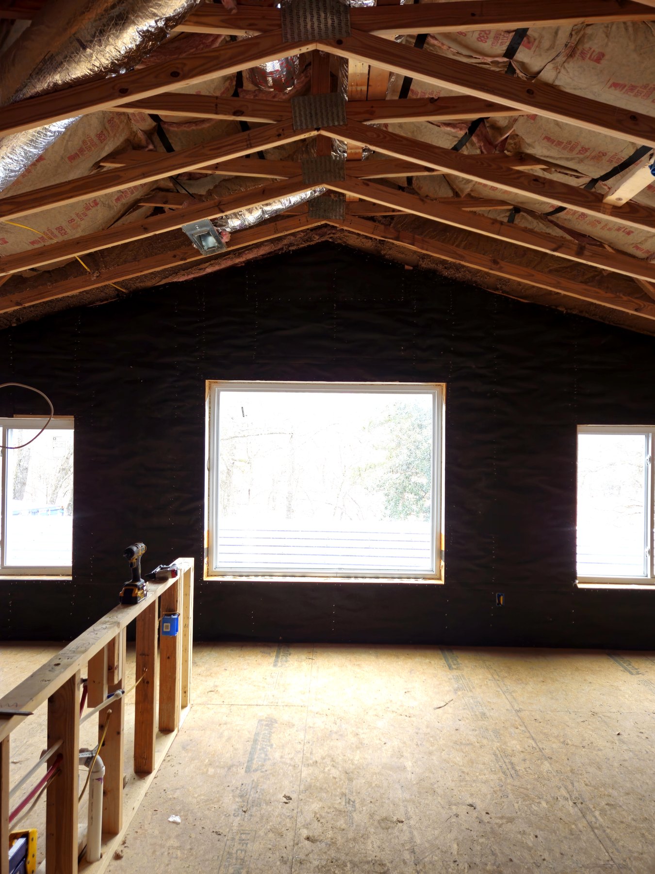 Interior wood roof framing and wall framing inside a residential build