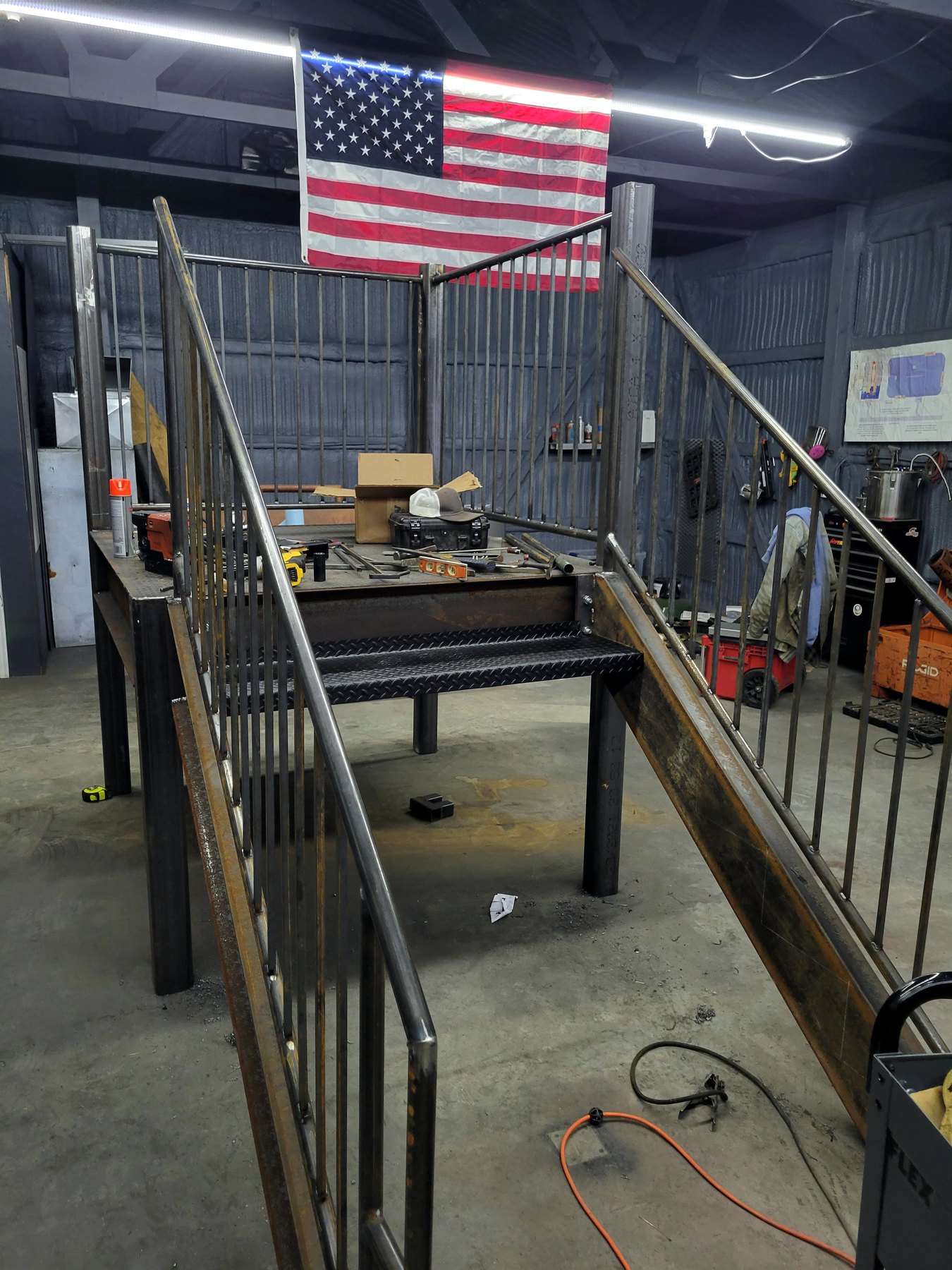 Steel railing or stair component being fabricated in a shop