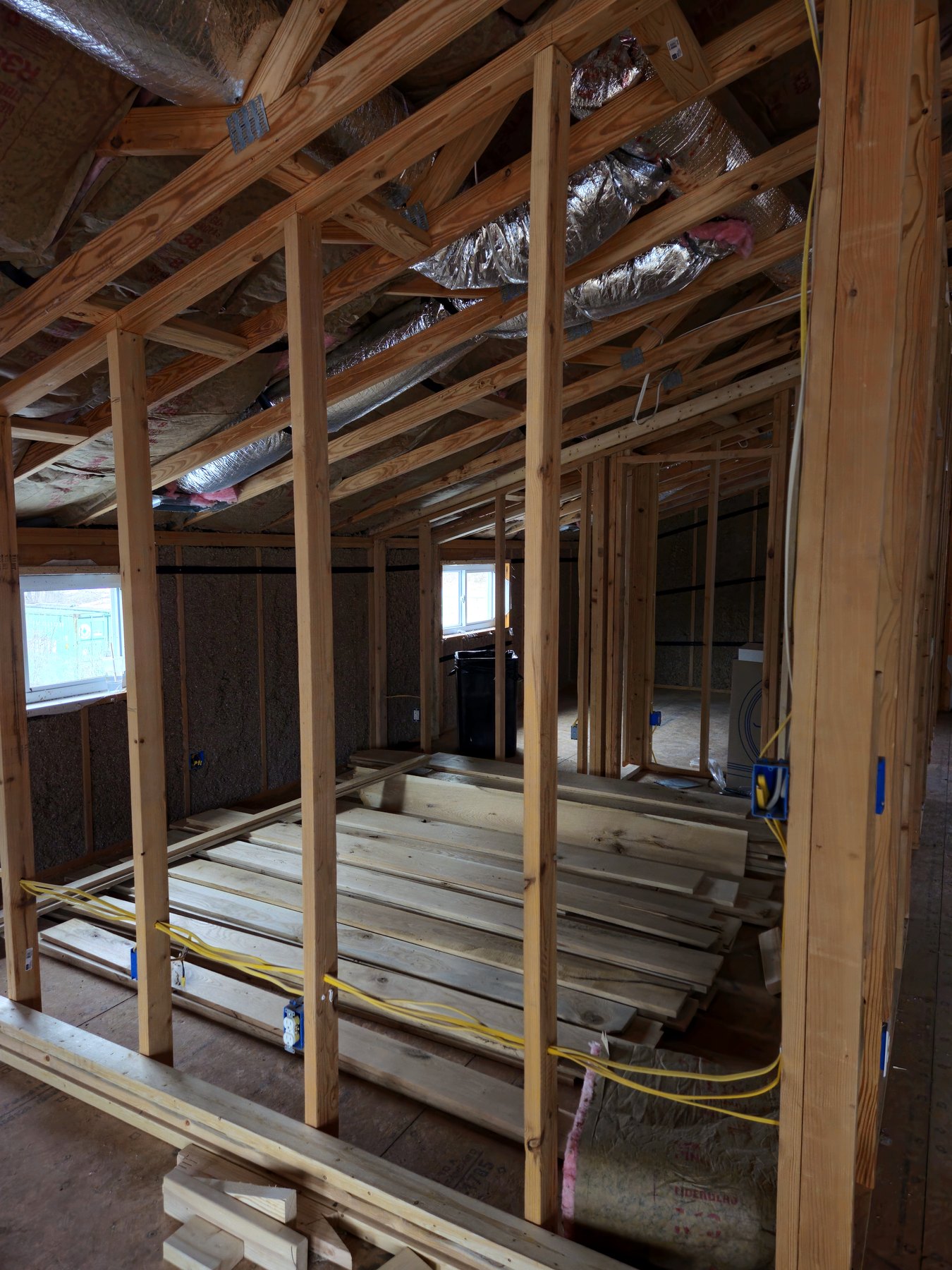 Wood-framed hallway walls and roof structure during residential construction